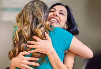 Two women embracing at the Y