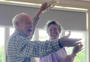 Lewis on his tambourine with Janie 