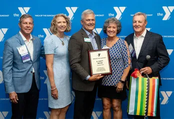 Scott Goyer holding his award.