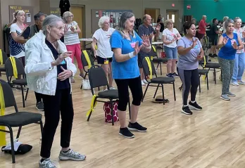 Seniors practicing Tai Chi indoors at the Hernando County YMCA.