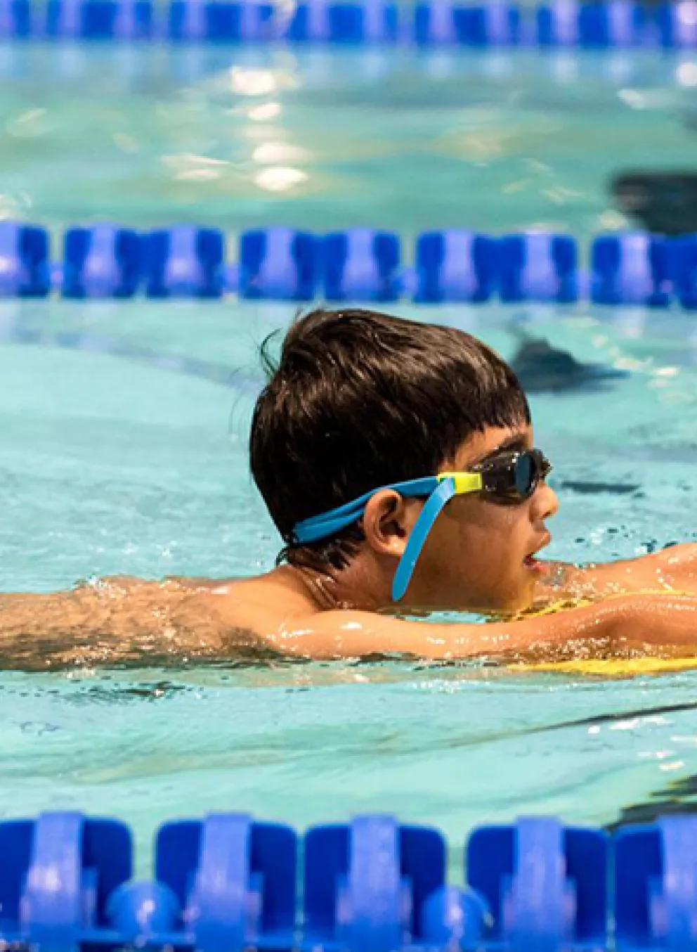 boy using a mini board for safety arond water