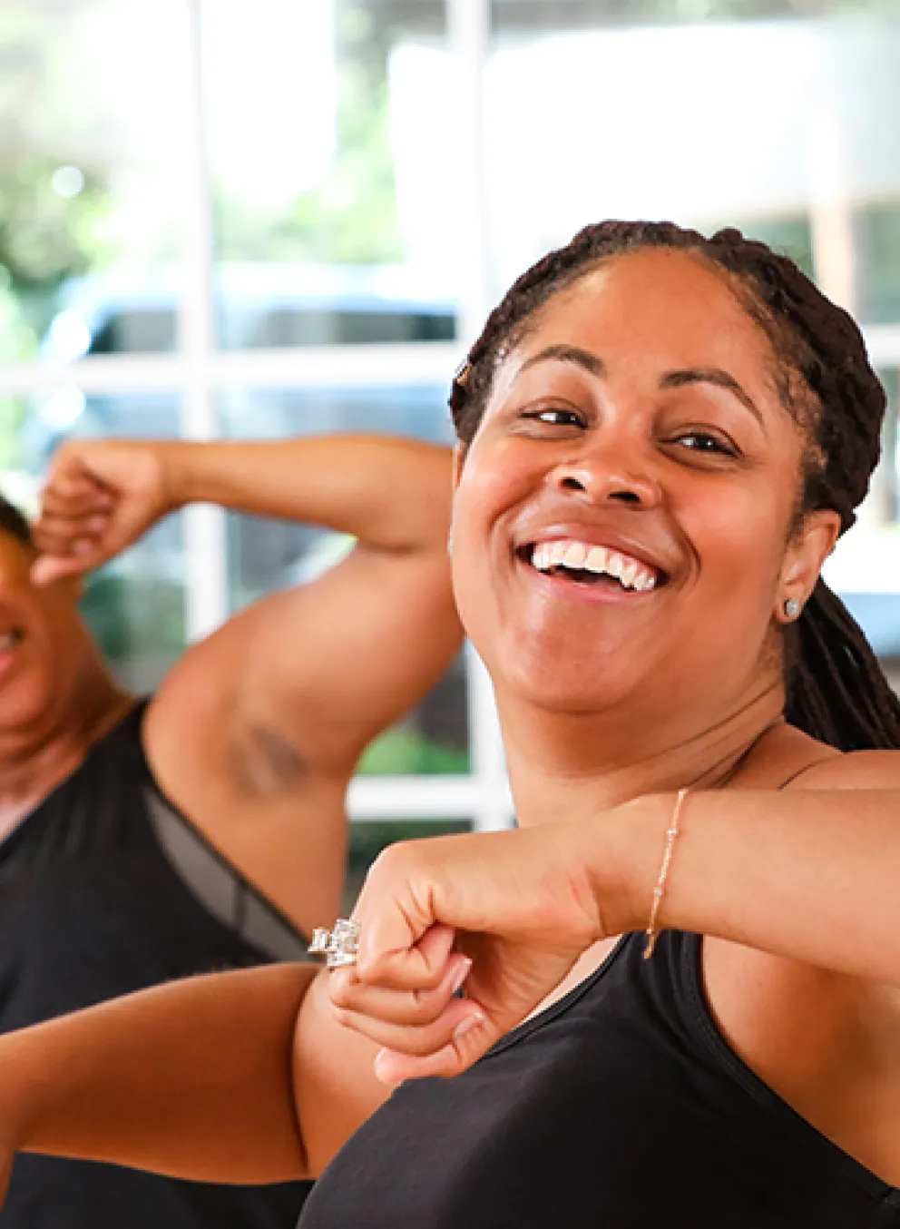 two women participating in the weight loss program aerobics class