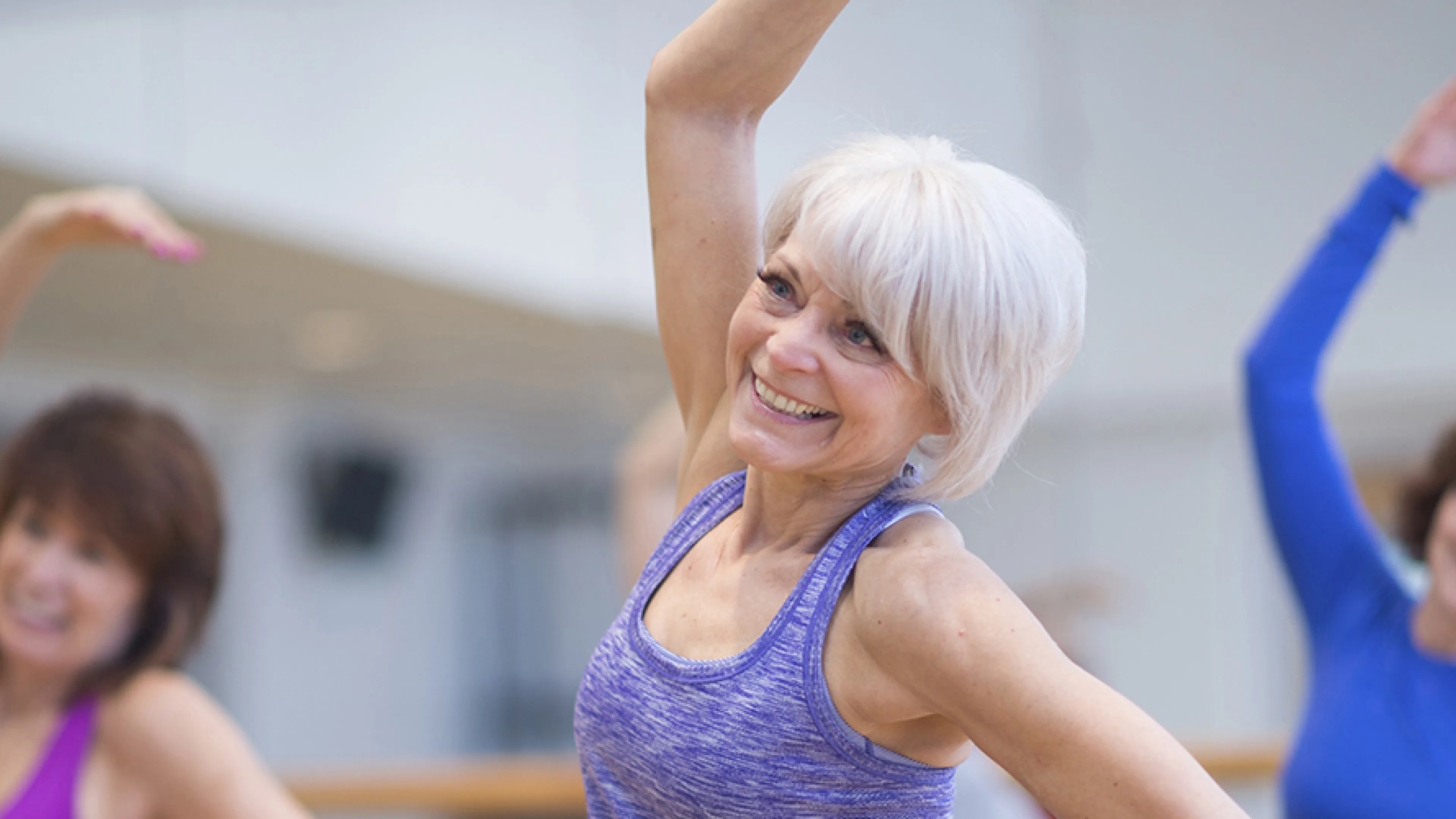 active older woman enjoying low impact small group exercise