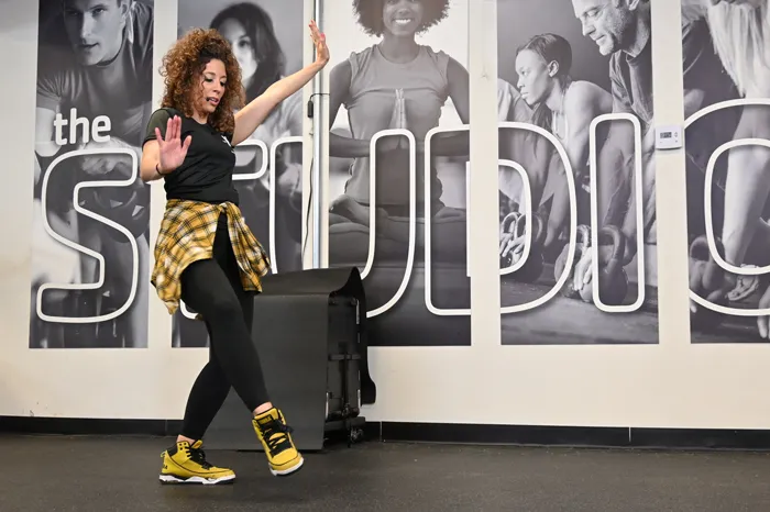 Zumba instructor posing in a dance move.