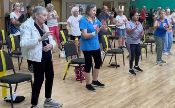 Seniors practicing Tai Chi indoors at the Hernando County YMCA.